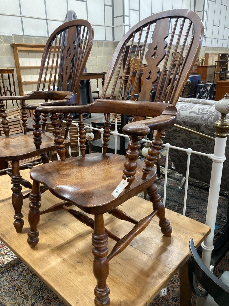 A near pair of 19th century ash and elm Yorkshire Windsor armchairs, larger width 63cm, depth 48cm, height 114cm